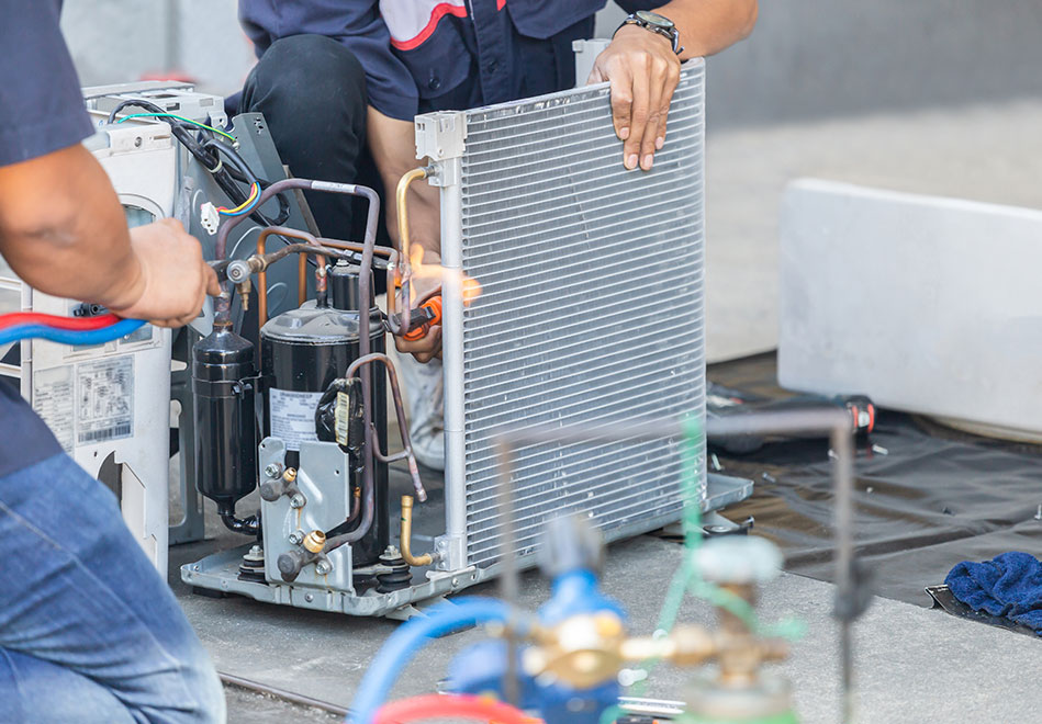 Close up of Air Conditioning Repair team use fuel gases and oxygen to weld or cut metals