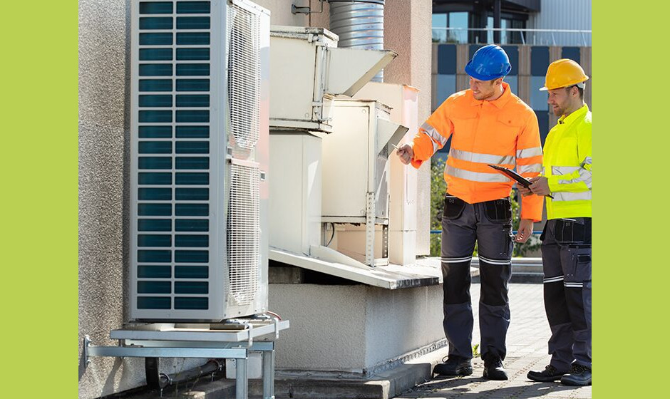 An Electrician Men Checking Air Conditioning Unit An Electrician Men Checking Air Conditioning Unit