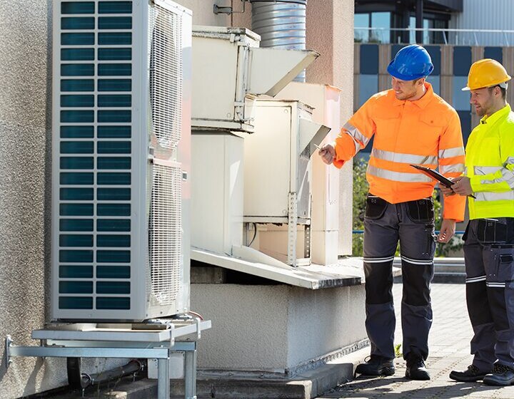 An Electrician Men Checking Air Conditioning Unit An Electrician Men Checking Air Conditioning Unit